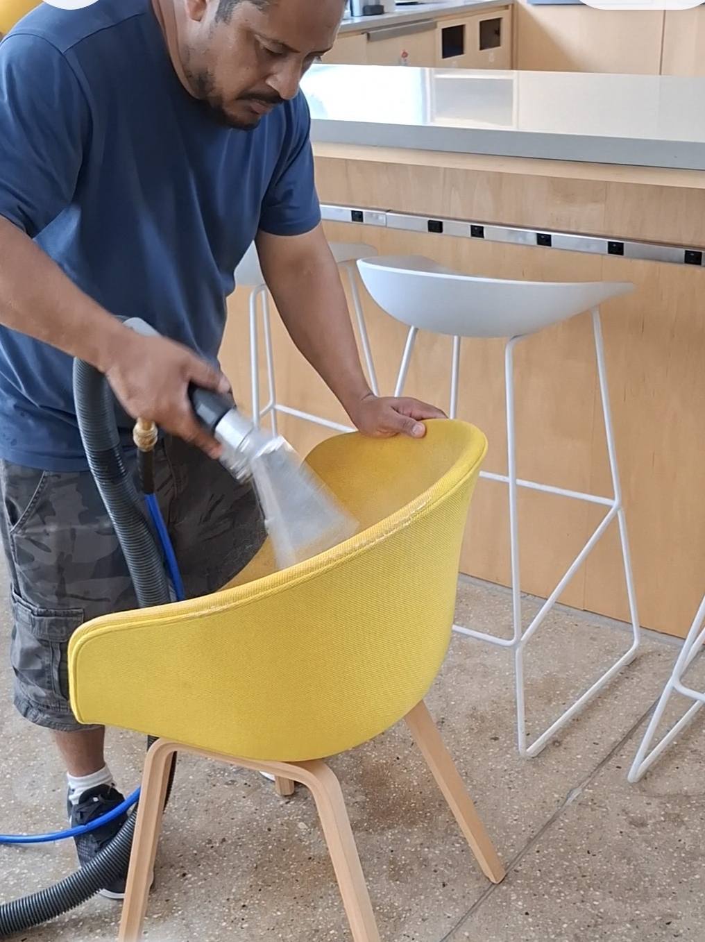 ABC Carpet Cleaning technician cleaning upholstery in Lynbrook, NY