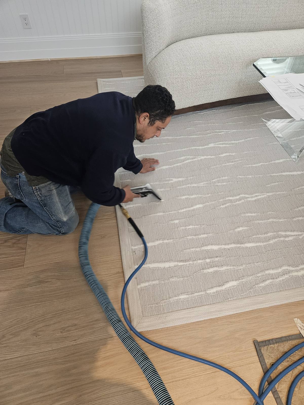 ABC Carpet Cleaning Long Island technician cleaning an area rug in a Nassau County home